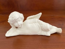 Vintage White Bisque Ceramic Angel Cherub Laying on side Figurine 