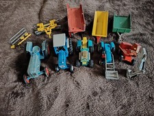 Bundle of vintage tractors and trailers. Playworn, damaged and paint splattered.