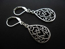 A PAIR OF TIBETAN SILVER