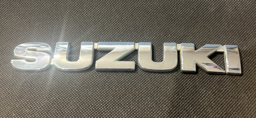 Suzuki car badge - car,