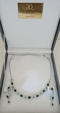Boxed vintage style emerald glass jewellery set. Necklace and earrings.