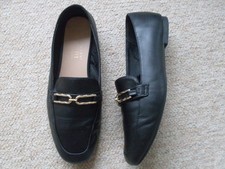 LADIES PRIMARK" SHOES.  SIZE 6. WIDE FIT, SLIP ONS.BLACK / GOLD METAL TRIM.  GC