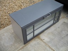 Grey drop front kitchen cabinet with glass shelf
