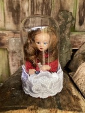 HAUNTED TINY DOLL IN GLASS