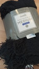 Dunelm boucle tassel throw