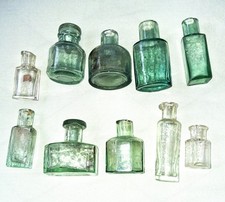 Ten Small vintage glass bottles (mostly less than 7cm high)