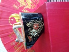 Chinese Trinket box in the shape of a geisha shoe. lacquered. flower pattern. 