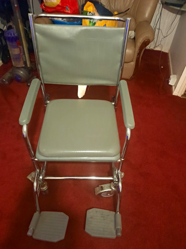 Grey commode wheelchair with - commode,