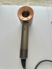 Dyson HD08 Supersonic Hair Dryer - Nickel/Copper (389923-01) with 5 attachments.