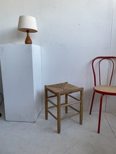 Large wooden rustic stool with a woven rush straw seat vintage