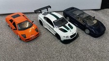 3 x 1/18 model cars, 2 metal, 1 ex R/C plastic. For spares or repair. No boxes.