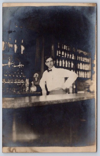 Vintage bartender leaning - leaning, on