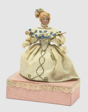 ANTIQUE DOLL VENDING MACHINE