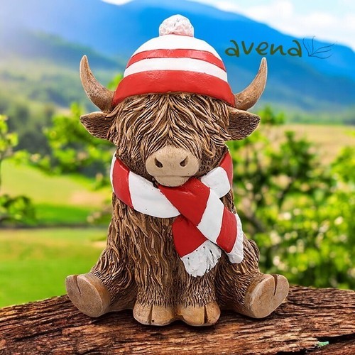Highland cow with red football - with,