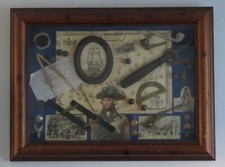 . Wood framed collection of antique Victorian memorabilia relating to Nelson