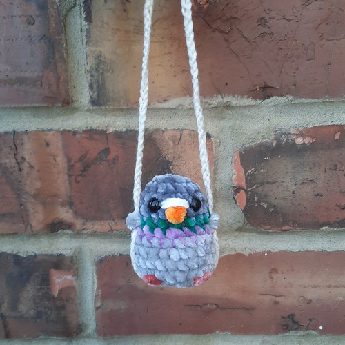 Pigeon swing car mirror - on, a