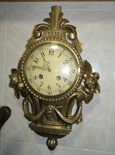 Wall clock carved gilded