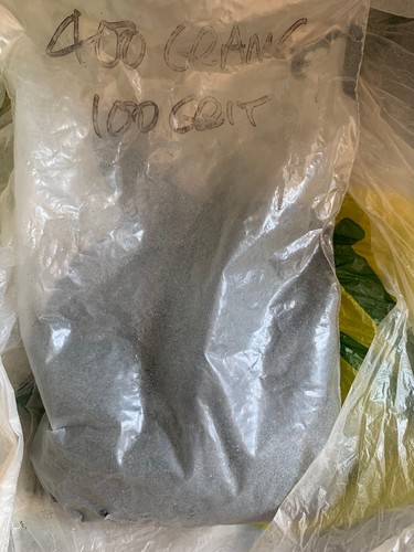 Carborundum powder just - just, under