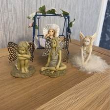 Set of 3 Fairy Ornaments and Figure on a Swing Chair