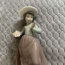 NAO - Girl with basket of flowers