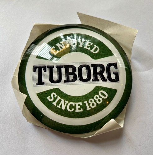 Tuborg lager beer round - , fish