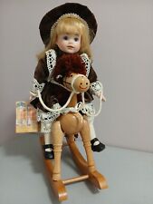 Vintage Porcelain Doll. Victorian child on Wooden Rocking Horse Andrew Schofield