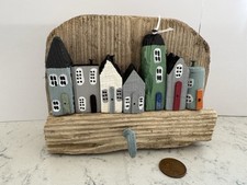 7 WOODEN  HOUSES ON A PIECE OF DRIFTWOOD. HANDMADE.