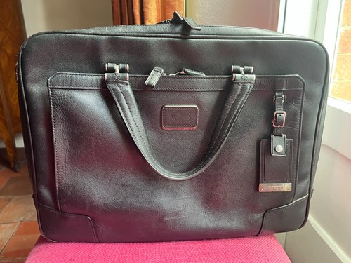 Tumi black leather - black,
