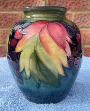 MOORCROFT LEAF AND BERRY VASE ON BLUE/GREEN GROUND CIRCA 1945-49