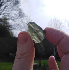 moldavite crystal,beutiful shape,georgeus colour when held up to the light.