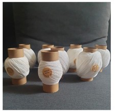 White cotton single-ply lace garn bobbins