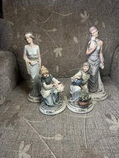 Four Belcari Lady Figurines 