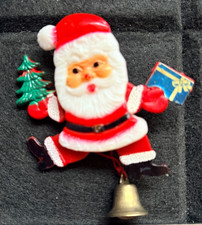 PLASTIC SANTA CLAUS WITH PRESENT AND TREE - PULL BELL ARMS LEGS MOVE PIN BADGE