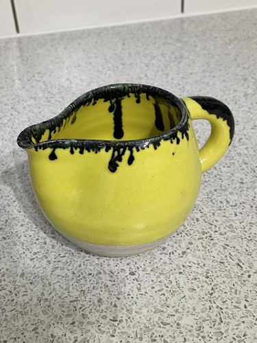 Unusual yellow glazed jug with - yellow,