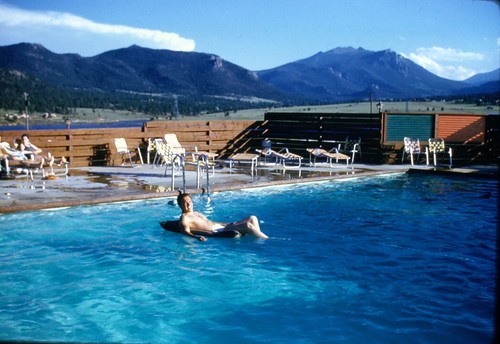 Shirtless man inner tube pool - man,