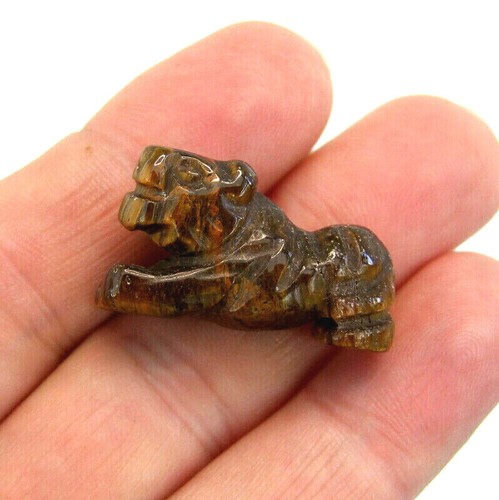 Gemstone lion and tiger - tiger, hand