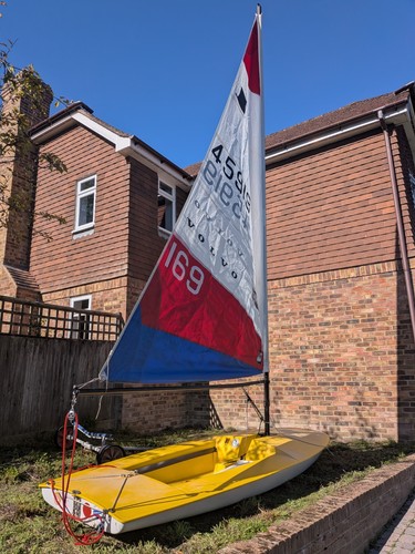 Yellow topper sailing dinghy