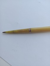 Vintage novelty advertising propelling pencil and cigarette holder.