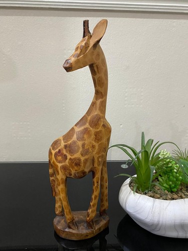 Hand carved wooden giraffe - hand,