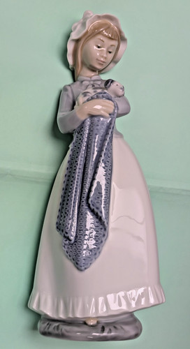 Nao lladro girl holding - by,