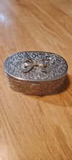 Vintage oval trinket box in silver with a raised pattern