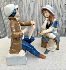 Rare Pair of Nadal Figurines, Boy Artist Sketching Girl sitting on Suitcase, 11"