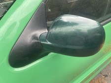 Vw Polo 6N2 Stubby Nearside Mirror. Passenger side. Green LC6M 1999-2001.