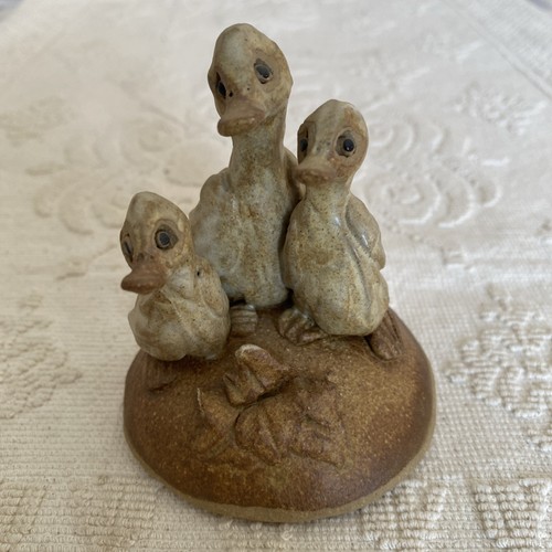 Pottery figurine family of - -,