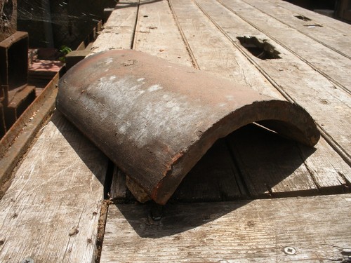 Reclaimed red clay - third, round