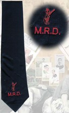 Navy cricket tie - a cricketer figure with M.R.D written underneath