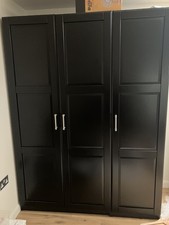 Black IKEA 3 door freestanding UNDREDAL panelled wardrobe with lights