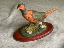 Pheasant Figurine on wooden