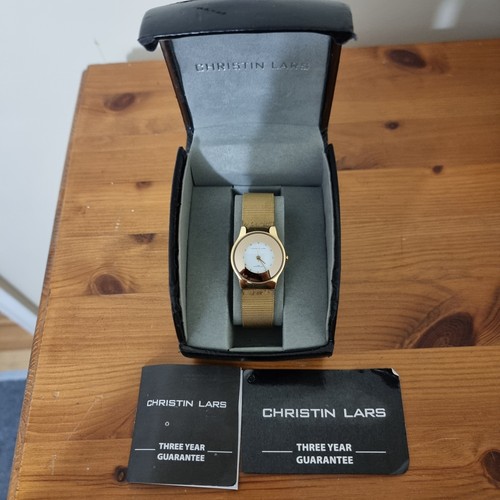 Christin lars gold watch with - lars,