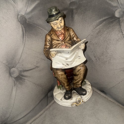 Figure figurine man reading